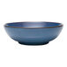 A close-up of a blue Libbey Canyonlands stoneware bowl with a black rim.