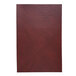 A brown leather menu cover with a red leather piece of paper on the front.