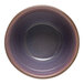 A purple stoneware bowl with a brown rim.