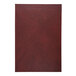 A red leather menu cover with a white surface.