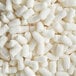 A pile of Lavex Compostable Starch Packing Peanuts.