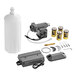 A grey plastic Chicago Faucets E-Tronic 80 battery-powered liquid soap dispenser kit with a white bottle and several batteries.