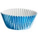 A close up of a blue paper cupcake liner with a white rim.