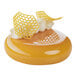 A yellow dessert with a honeycomb design on top from a Pavoni Gourmand honeycomb silicone baking mold.