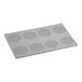 A grey rectangular Pavoni Gourmand silicone baking mold with honeycomb-shaped cavities.