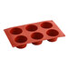 A red Pavoni silicone baking mold with six muffin compartments.