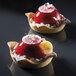 Two small round desserts with red gelatin toppings in Pavoni Formasil molds.