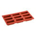 A red Pavoni silicone baking mold with nine rectangular compartments.