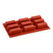 A red Pavoni silicone baking mold with 9 rectangular cavities.