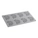 A grey Pavoni silicone baking mold tray with 8 coral rectangular cavities.