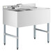 A Regency stainless steel underbar sink with two bowls, faucet, and right drainboard.
