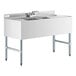 A stainless steel Regency underbar sink with 2 drainboards and a faucet.
