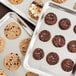 A Nordic Ware rimmed sheet pan with chocolate chip cookies.