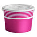 A pink and white Choice paper frozen yogurt container with a lid.