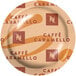 A box of 50 Nespresso Professional Caffe Caramello single serve coffee capsules on a table.
