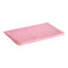 An Oxford pink quilted mattress pad on a white background.