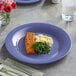 A purple Acopa Foundations melamine plate with salmon and spinach on a table.