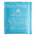 A blue Harney & Sons Organic Earl Grey Tea packet with white text.