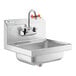 A stainless steel Regency wall mounted hand sink with faucet.