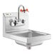 A Regency stainless steel wall mounted hand sink with an eyewash station and orange faucets.