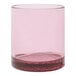 A Tossware Reserve Go-To Blush Tritan plastic rocks glass with a pink rim.