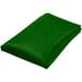 A green Intedge 54" round cloth table cover folded up on a white background.