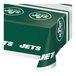 A white table cover with a green and white New York Jets logo and text.