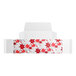 A white candy box with red poinsettia flowers on it.