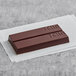 A TCHO 68% Dark Chocolate Bar on a white paper.