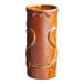 A close up of a brown ceramic Acopa Tiki Mug with designs.
