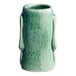 An Acopa green ceramic tiki mug with a handle.