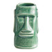 A close-up of a green ceramic face on an Acopa Tiki Mug.