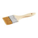 A Midwest Rake Professional paint brush with a wooden handle.