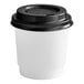 A white Choice paper hot cup with a black lid.