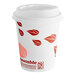 An EcoChoice paper hot cup with a white lid and red leaf print.