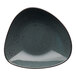 A triangular stoneware bowl in dark gray with blue speckles on it.