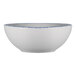 A white porcelain bowl with a blue sponged rim.