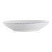 A white porcelain pasta bowl with blue sponged accents on the rim.