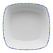 A white square porcelain bowl with blue sponged spots.