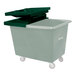 A green plastic Royal Basket Trucks hinged lid on a bin.
