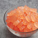 A bowl of Albanese Pink Grapefruit Gummi Bears on a table.