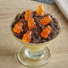 A bowl of Albanese Orange Gummi Bears in a dessert.