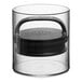A clear Prepara Evak Fresh Saver round food storage container with a black lid on a kitchen counter.