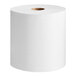 A roll of Tork white paper towels with a hole in the center.