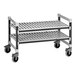 A grey and white metal Cambro Camshelving Elements undercounter mobile unit with two shelves on wheels.