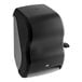 A black and grey Tork automatic roll hand towel dispenser.
