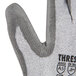 A close up of an extra small Cordova cut-resistant work glove with gray palm coating.