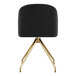 A Martha Stewart black velvet office chair with gold legs.