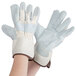 A pair of Cordova white canvas work gloves with leather palms and rubber cuffs on a white background.