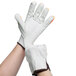 A pair of white Cordova leather driver's gloves with Hi-Vis orange fingertips.